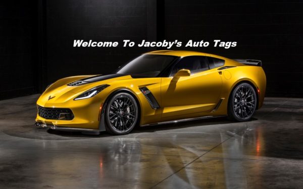 A yellow sports car parked in front of a building.